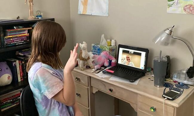girl doing online tutoring