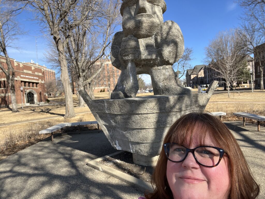 Jessica Williams in front of the viking statue at Augustana University